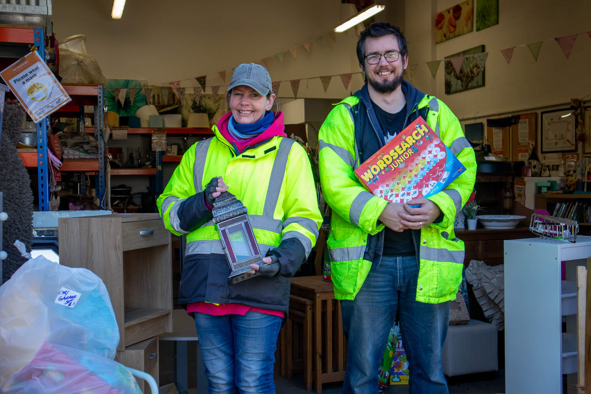 Rob and Serena holding items in the The Steelhouse