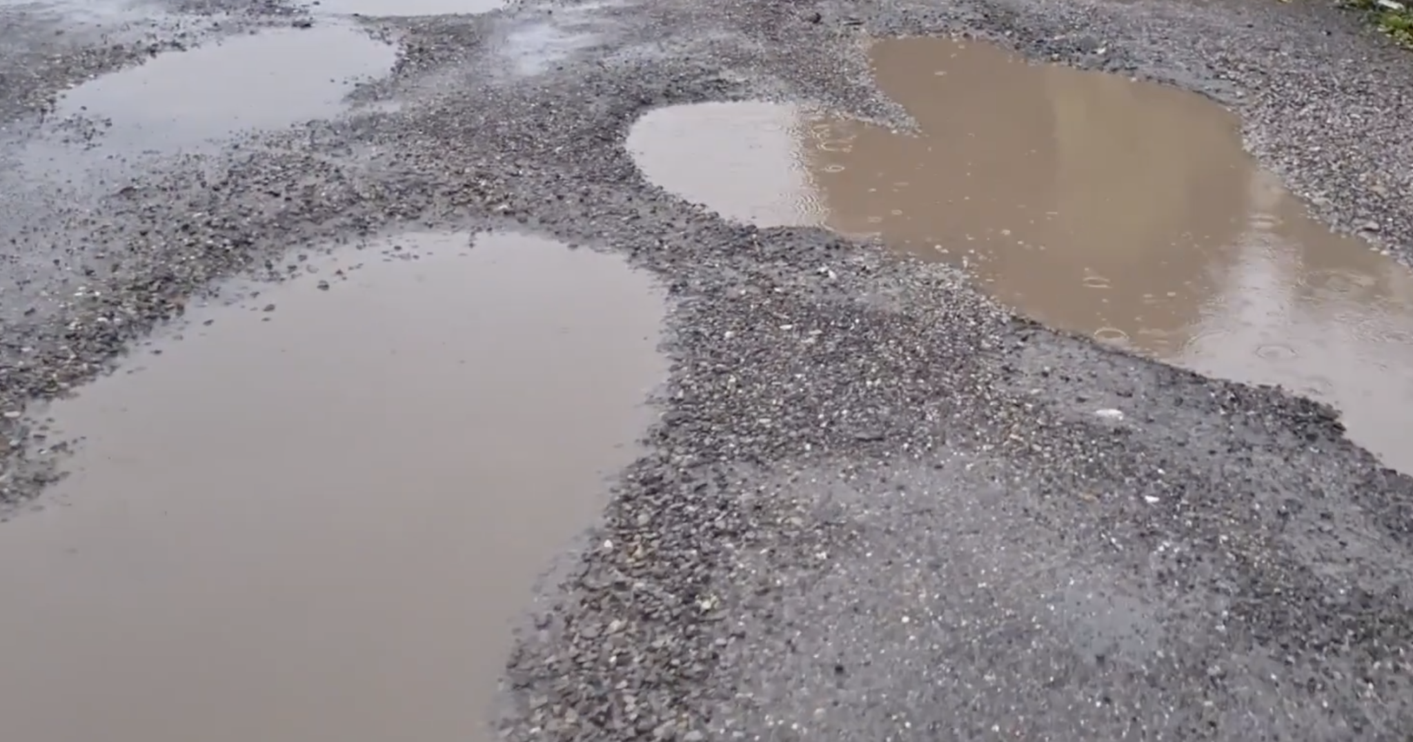 Water-filled potholes on Brook Street in Cwmbran