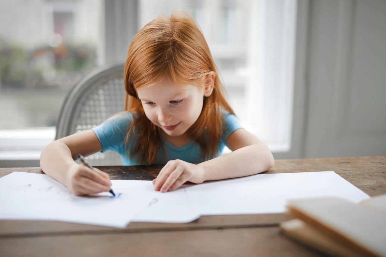 A girl writing in a book