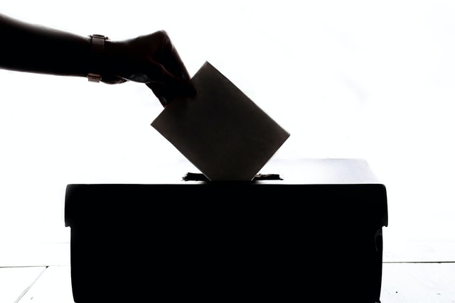 A vote being put in a ballot box