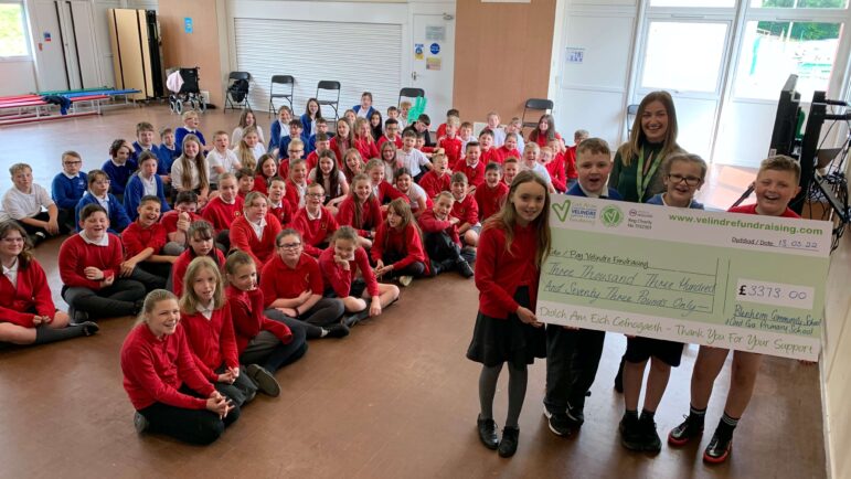 Children and a giant cheque