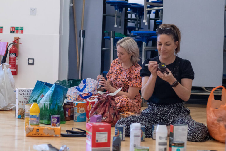 woman writes on a jar