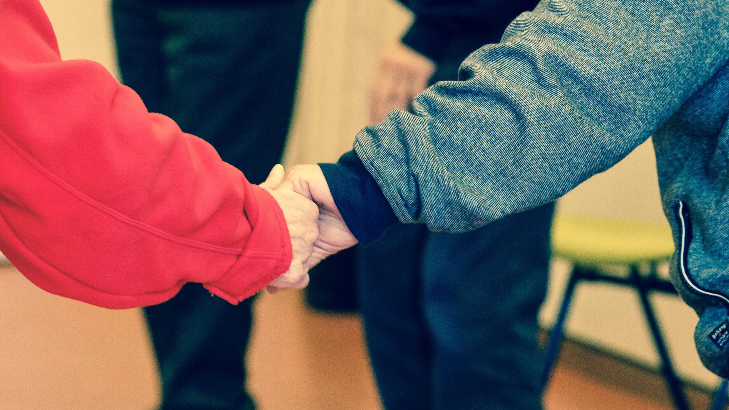 two people holding hands