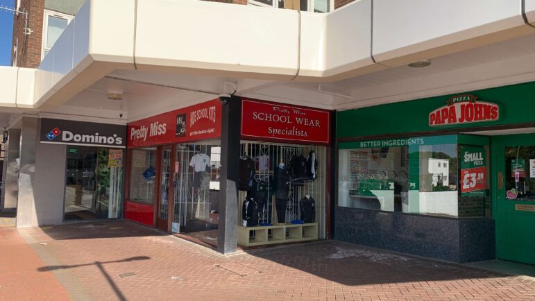 a row of shops in a town centre