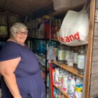 a woman stood in shed