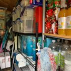 Shelves packed with bottles and packet