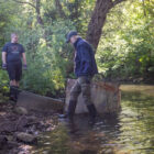 Man in wellies in river