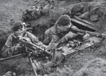 two soldier holding rifles in a dugout