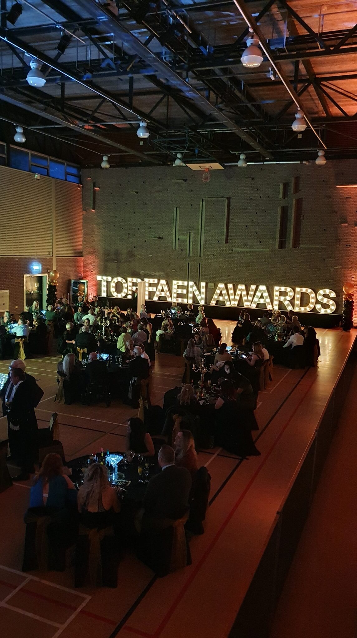 a lit up sign saying Torfaen Awards