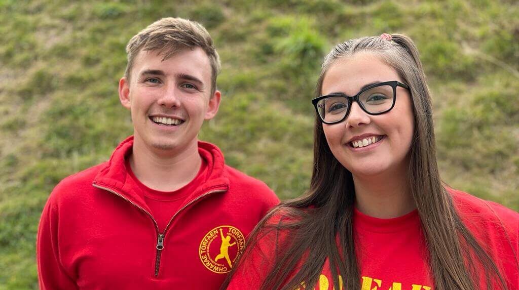 man and woman in red t-shirts