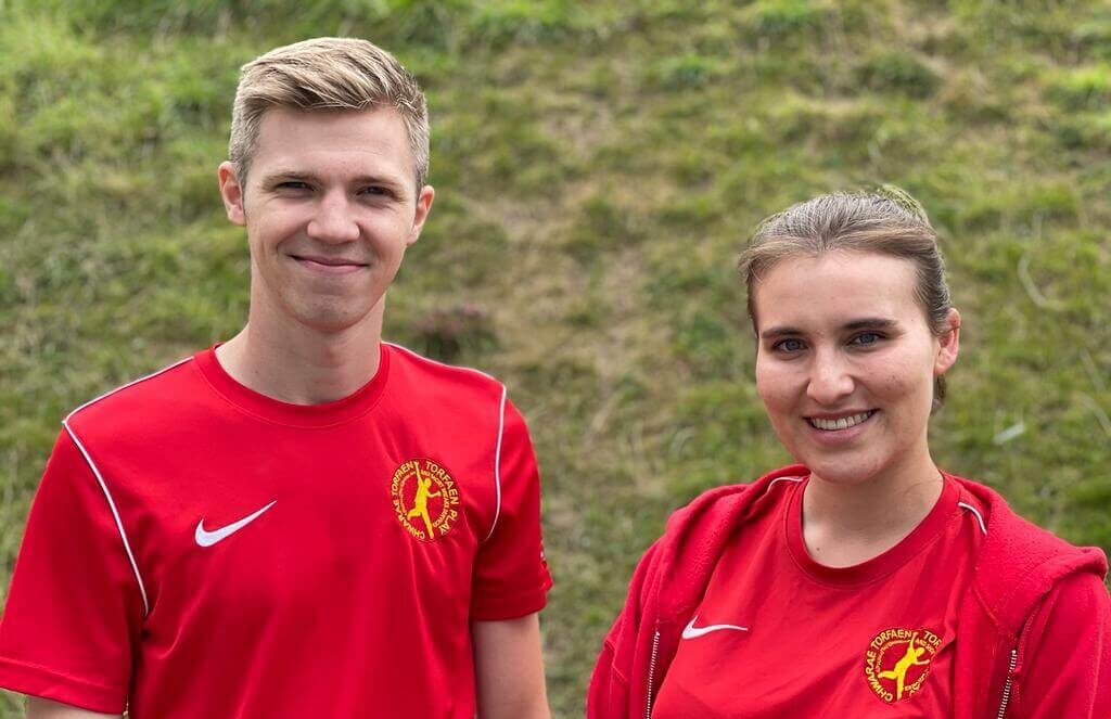 man and woman in red t-shirt