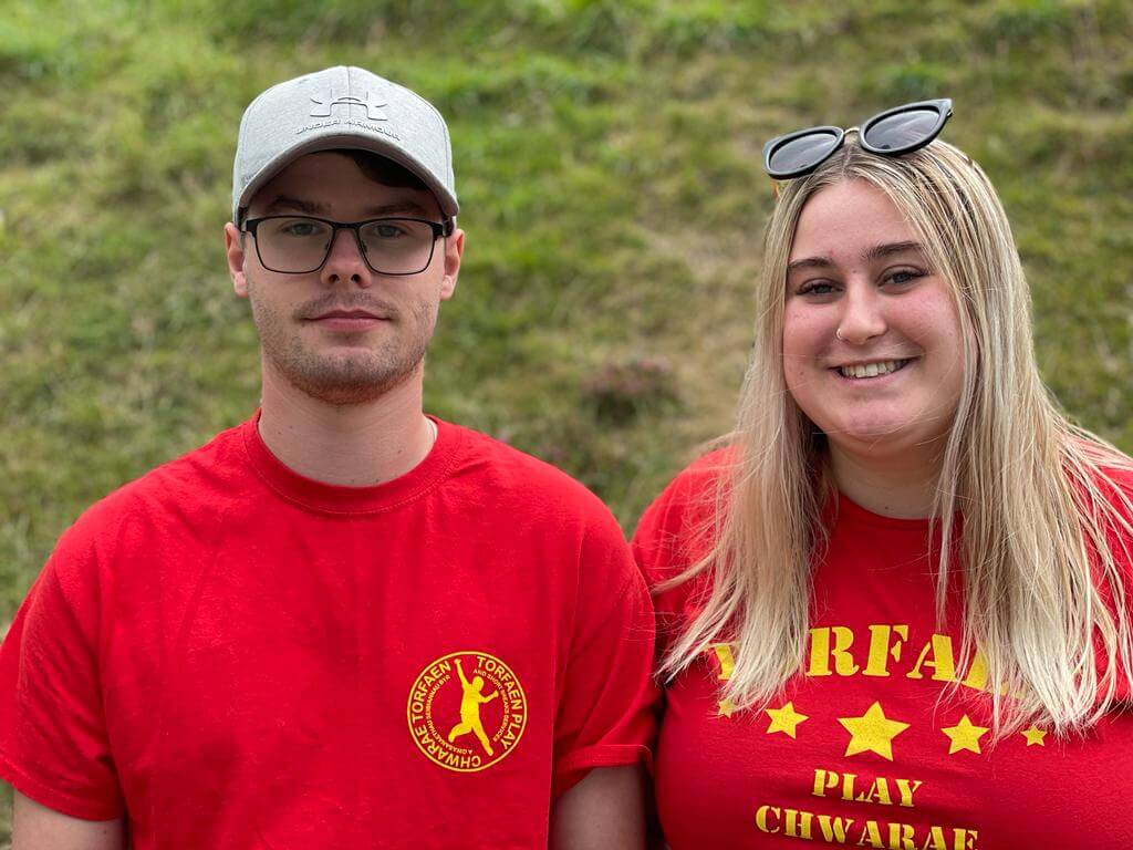 a man and woman in red t-shirts