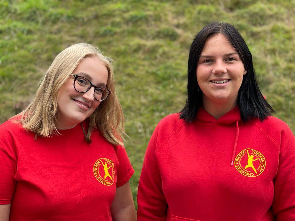 two women in red t-shirt