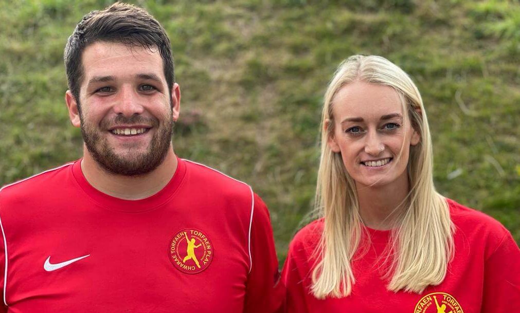 man and woman in red t-shirts