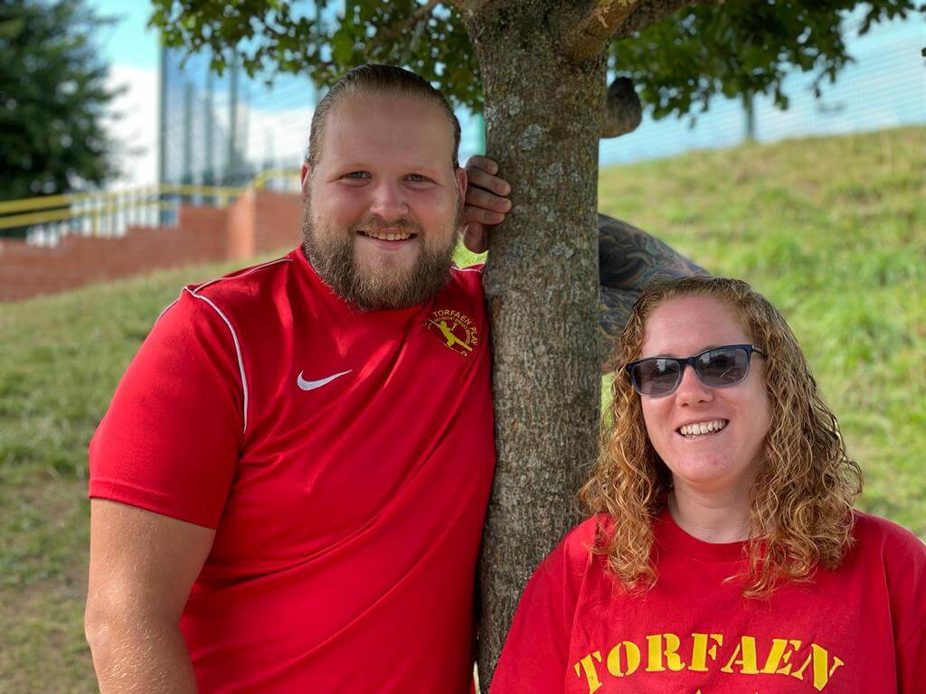 man and woman in red t-shirt