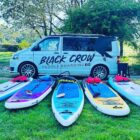 A VW with paddleboards on the floor