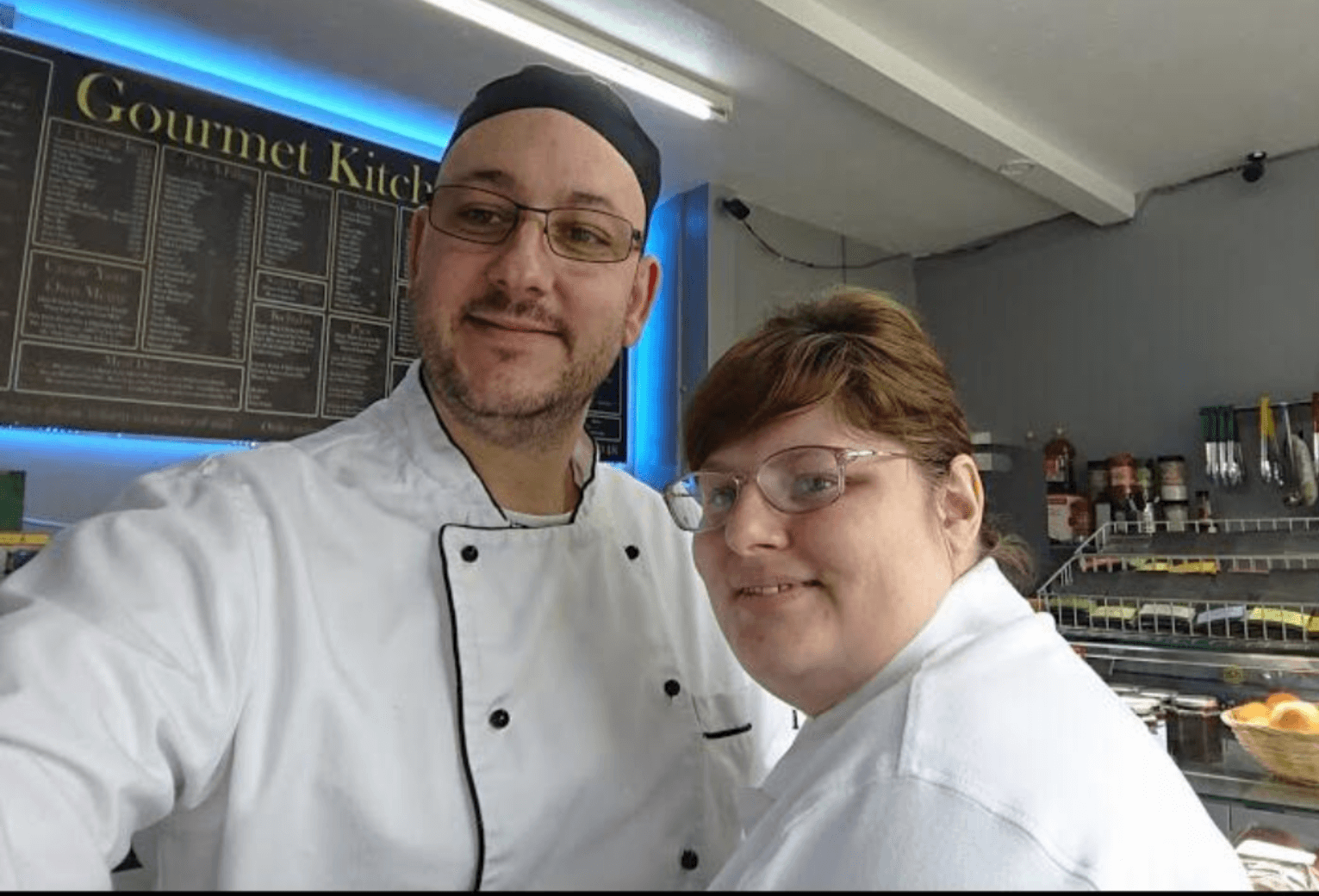 man and woman in kitchen