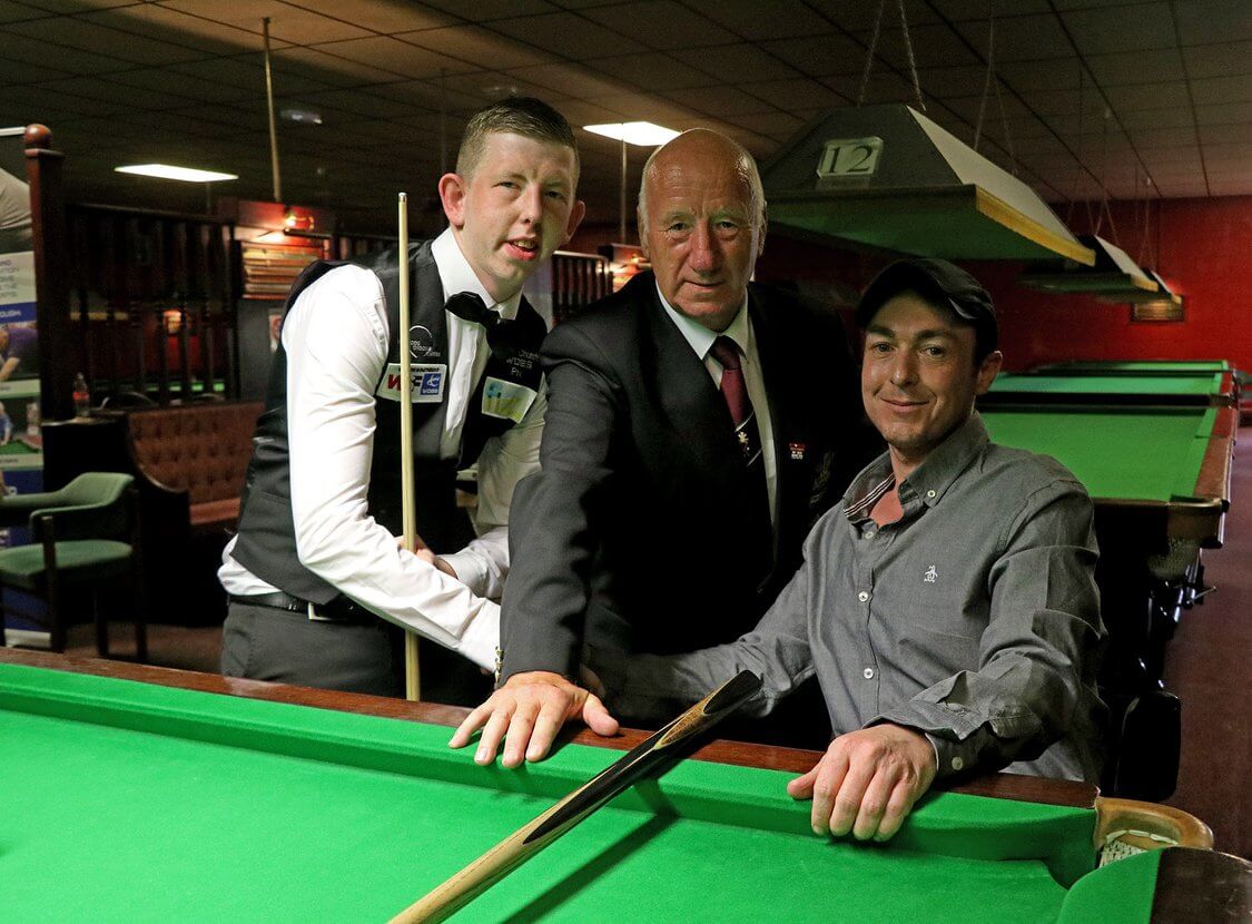 three men by a snooker table