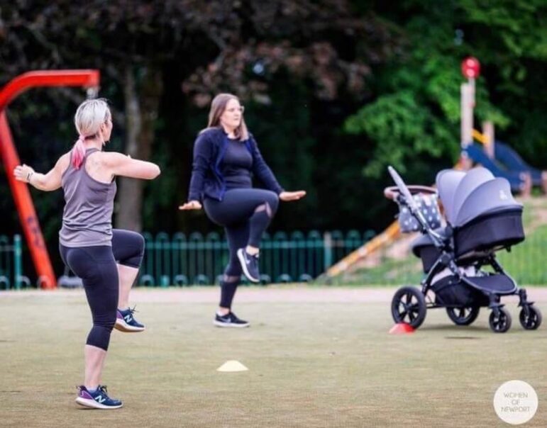 women exercise in park