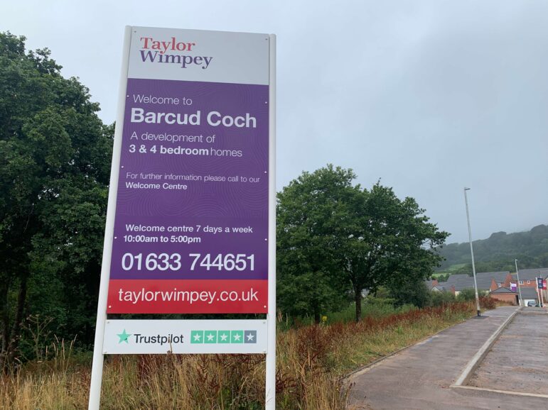 a sign for a new home development