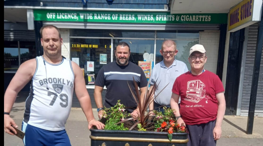 four men by a planter