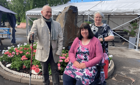 three people smiling