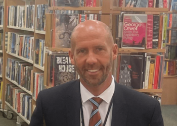 David Thomas in a library