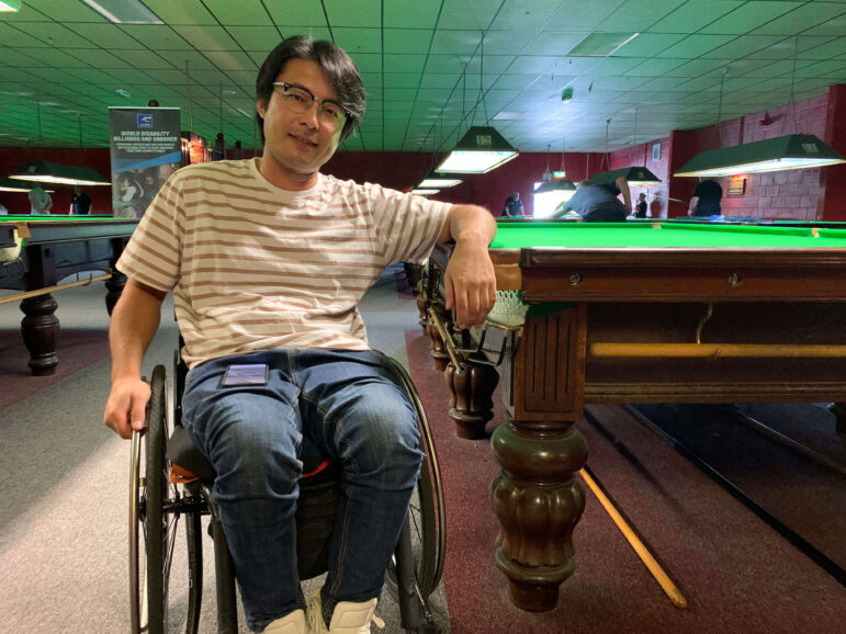 man in wheelchair by snooker table