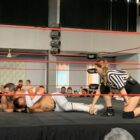 two wrestlers on the floor