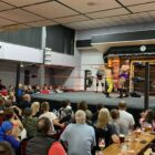 a wrestling match in a packed club