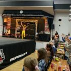 a wrestling ref lifts hand of winner