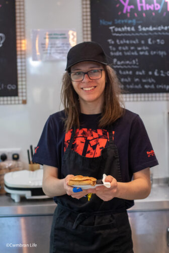 Zak holds a panini