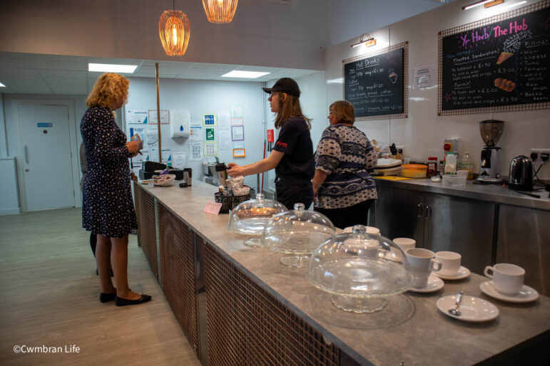 man serving customer in cafe