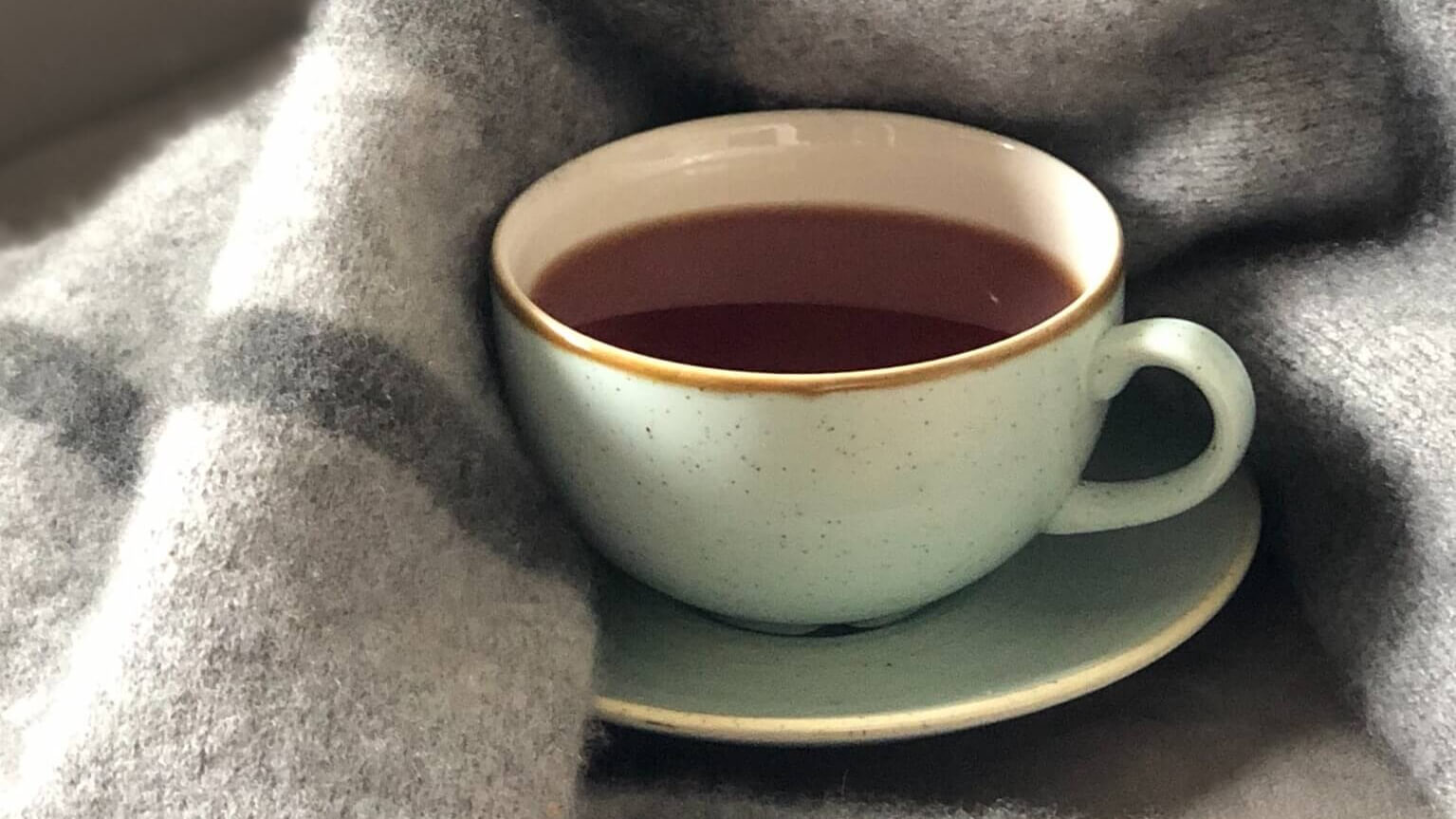 a cup of tea and a blanket