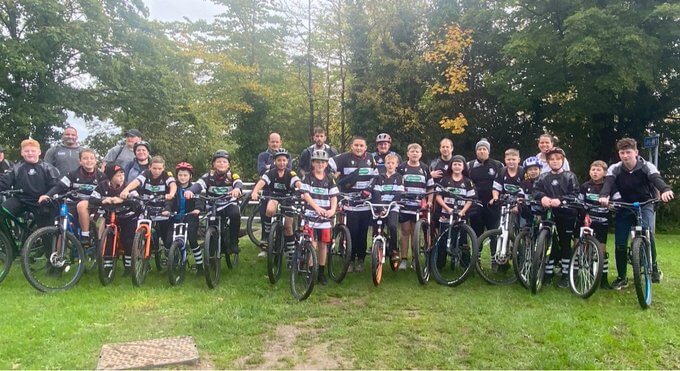 rugby players on bicycles