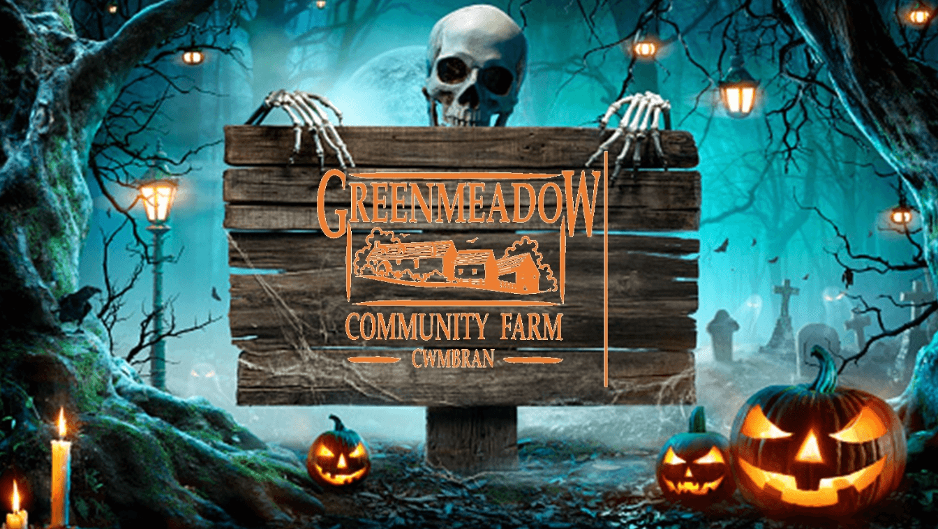 a cartoon skull by a sign for greenmeadow community farm
