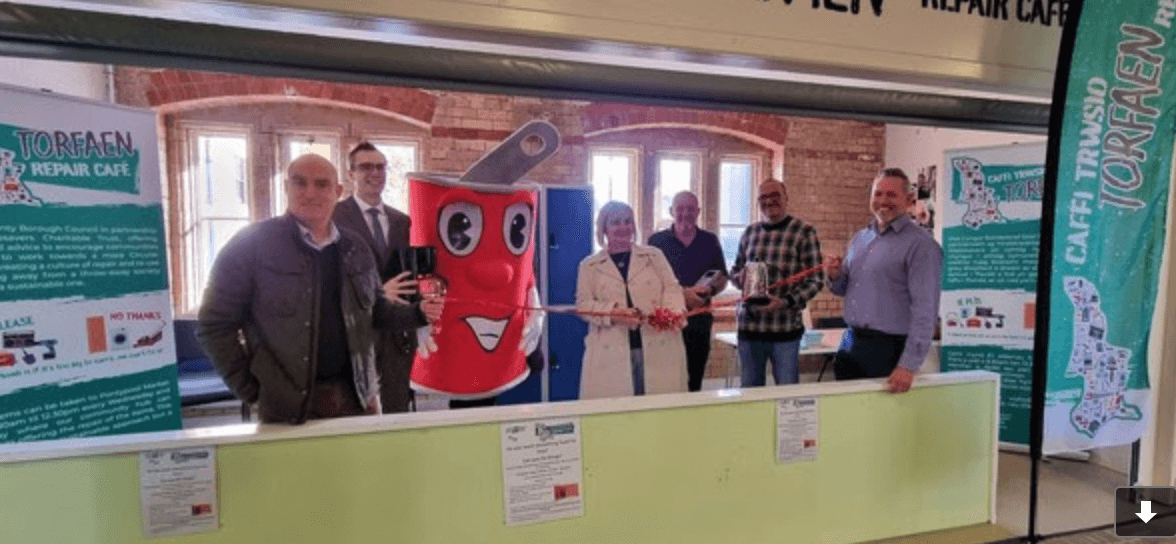A row of people stood at launch of repair cafe