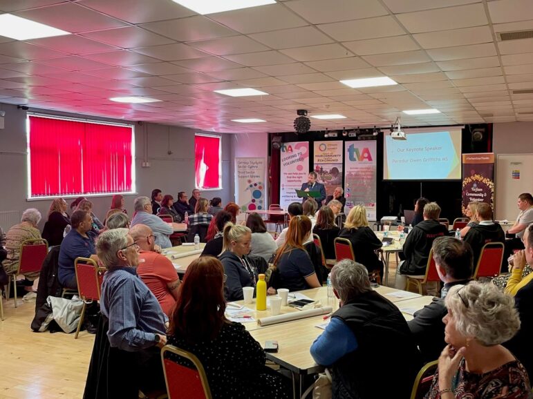 People sat at tables at conference