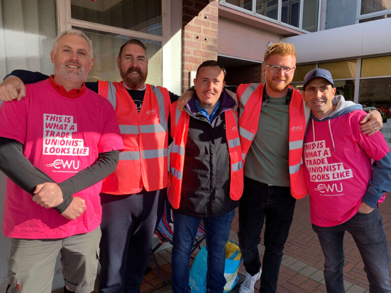 five men on a picket line