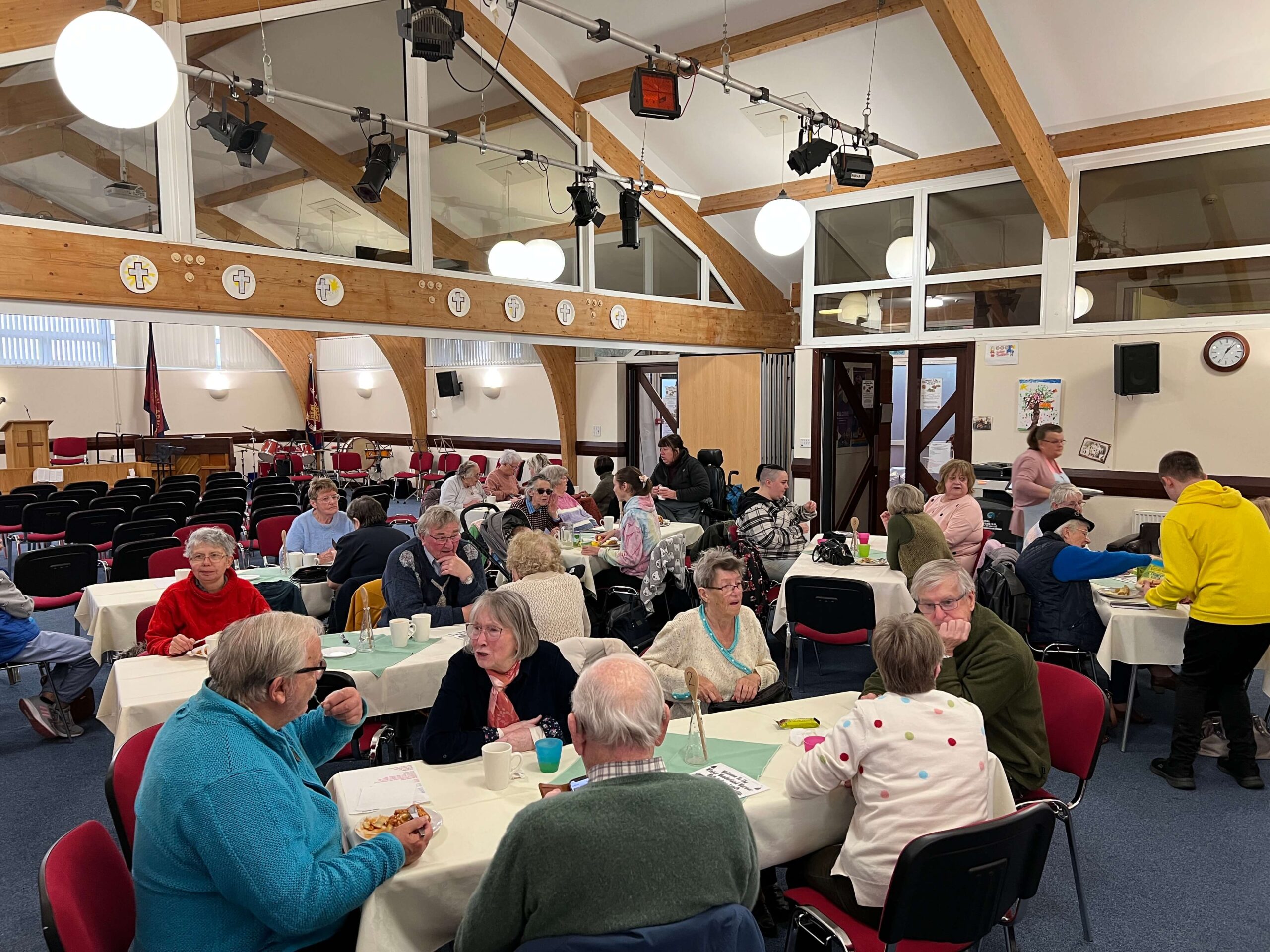 a roomful of people at a lunch club