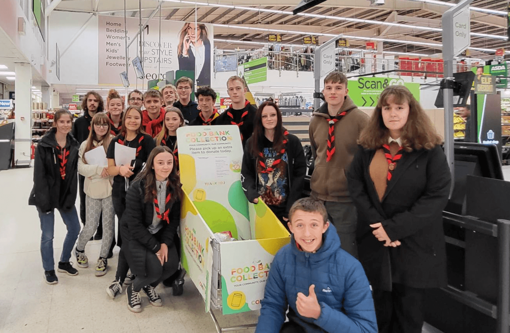 group of scouts by a trolley