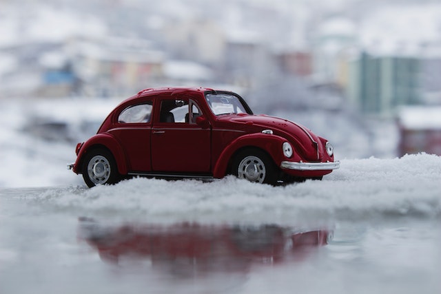 red Toy Car in Snow