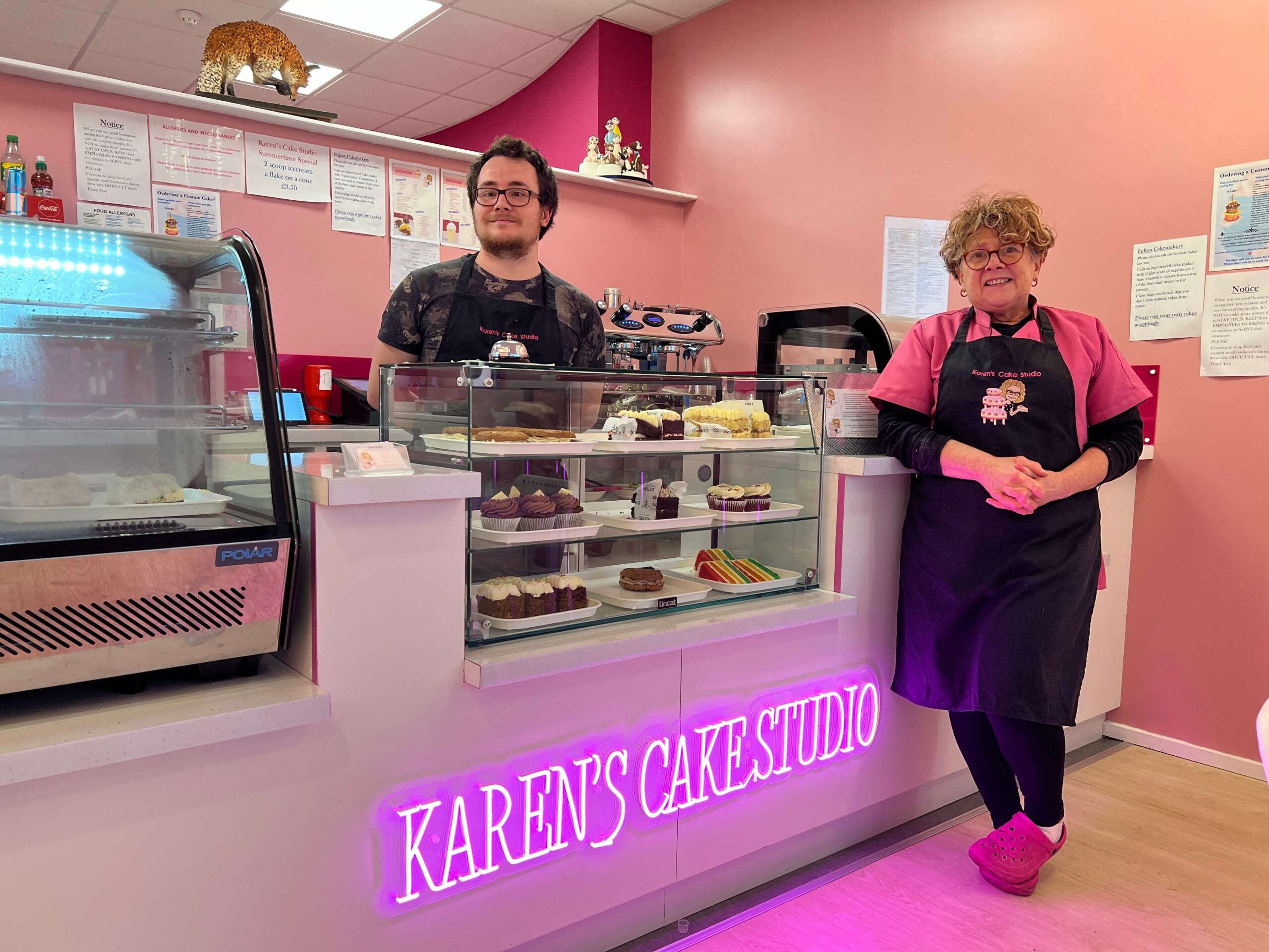 man and woman in cake shop