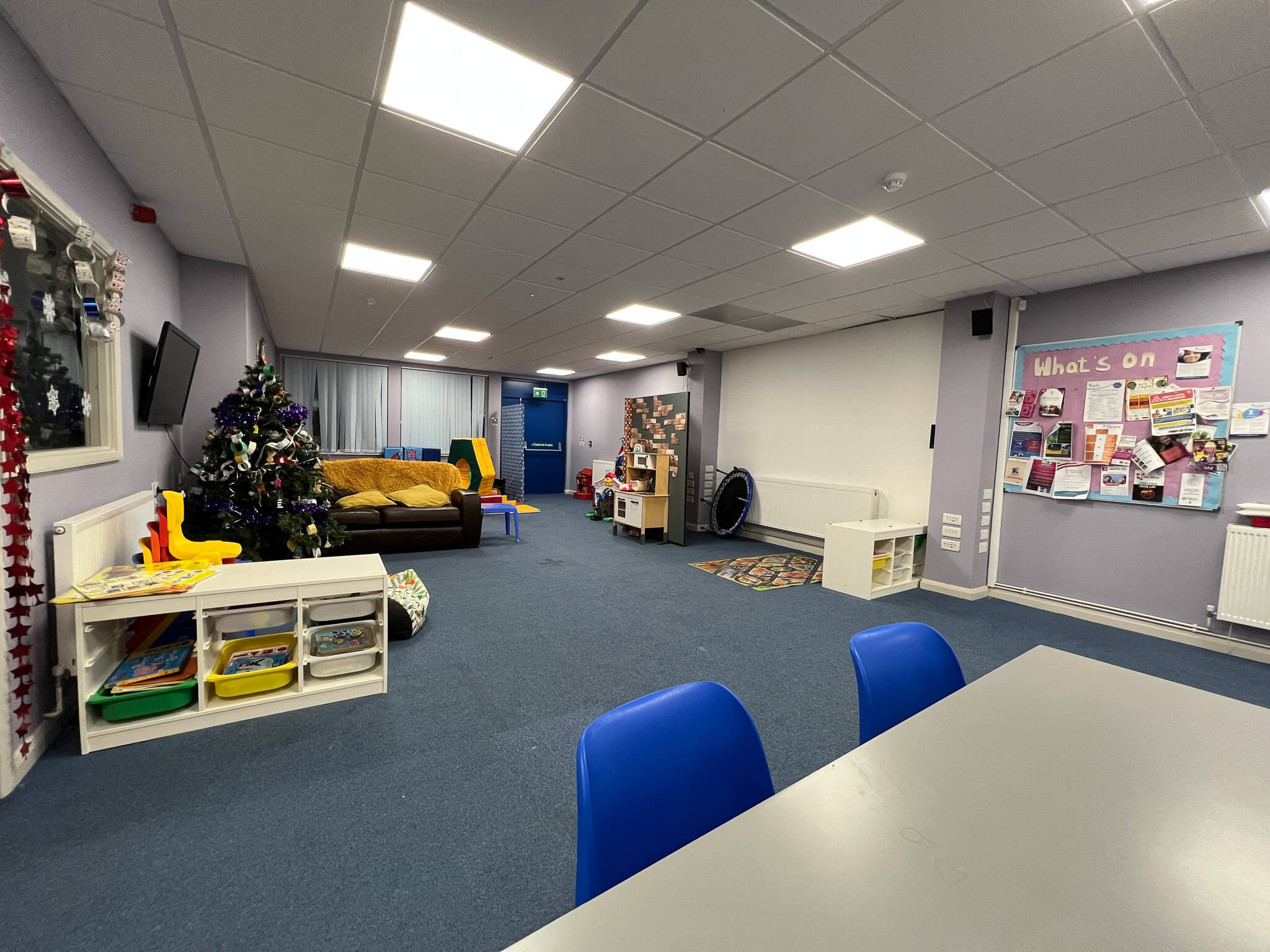 a large function room with tables and chairs