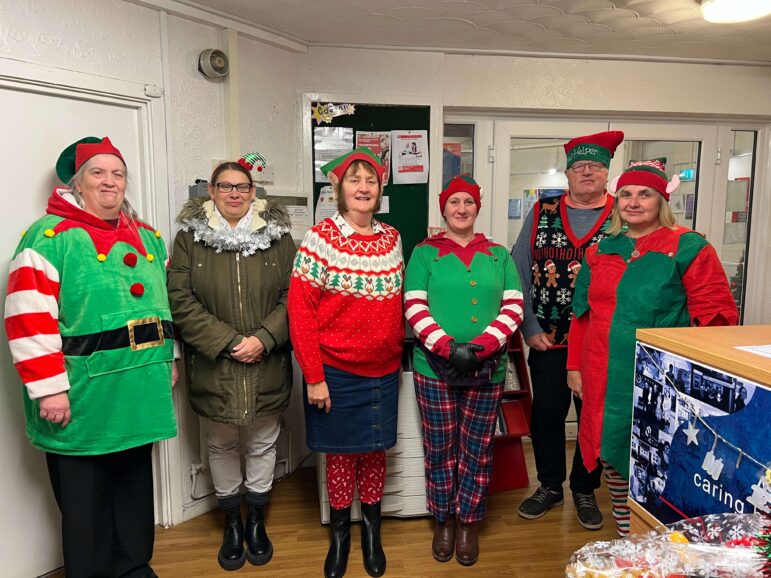 People dressed as Santa's elves