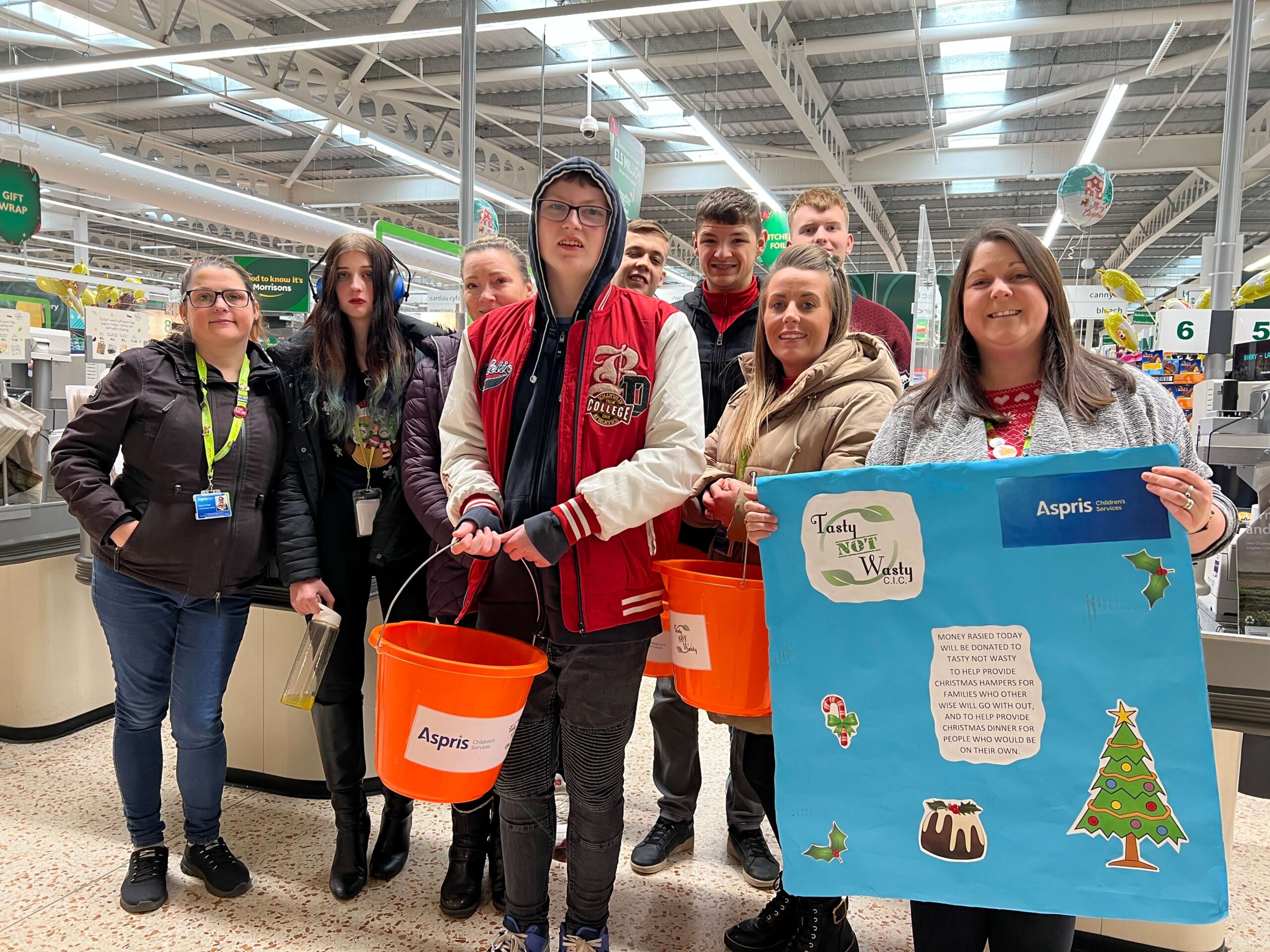 students at a supermarket bag pack