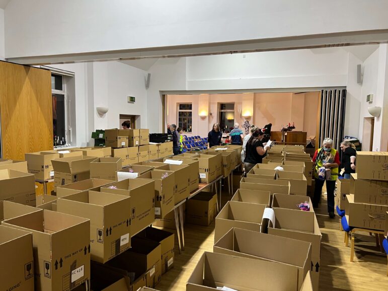 a church hall full of cardboard boxes