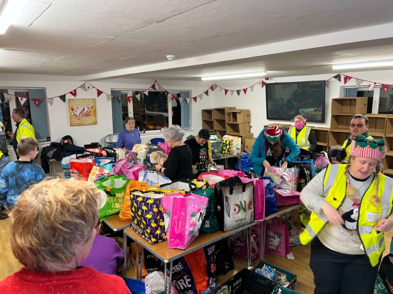 volunteers pack food bags