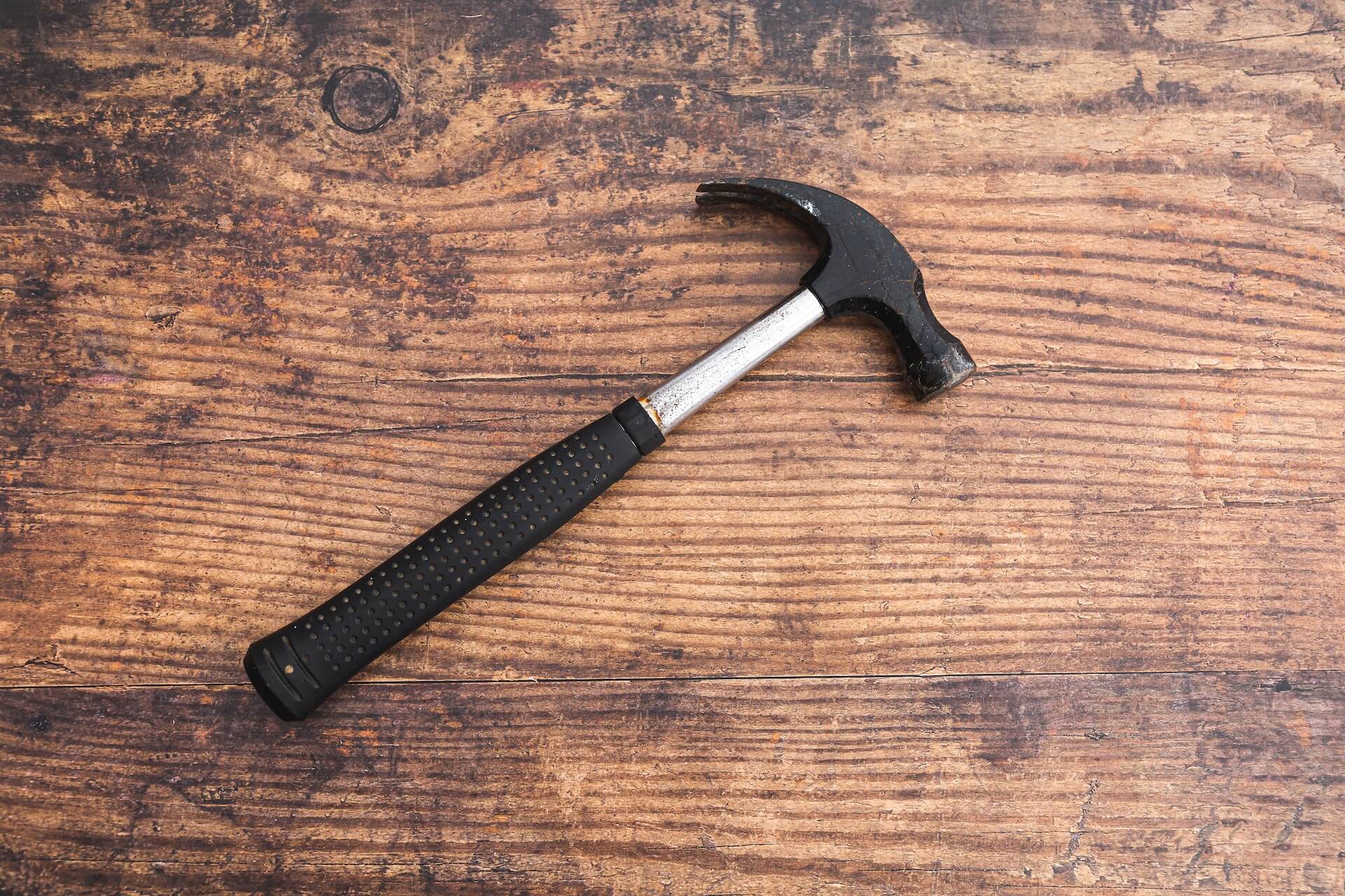 a hammer on wood table