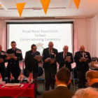 8 men make a pledge at a royal naval association event